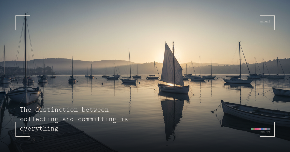 Harbour at dawn with moored sailboats, one boat with its sail raised catching the early light